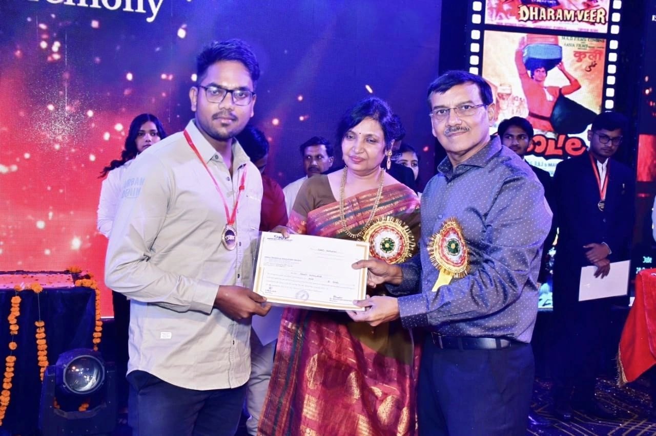 Rohit receiving his MCA certificate and medal at the convocation ceremony